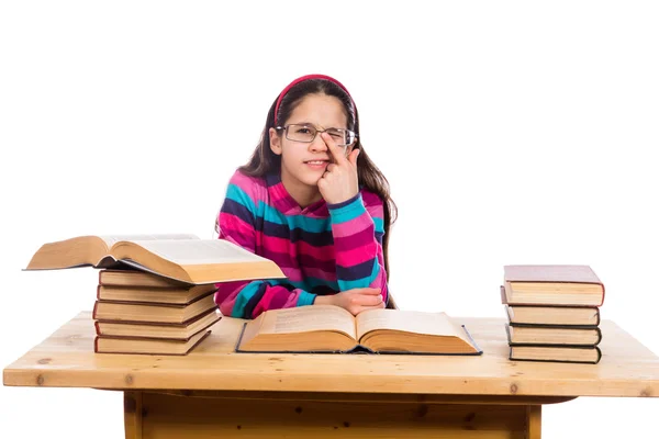 Grappig meisje met stapel boeken — Stockfoto