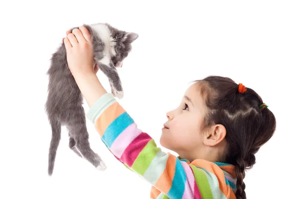 Little girl holding in hands adorable kitten — Stock Photo, Image