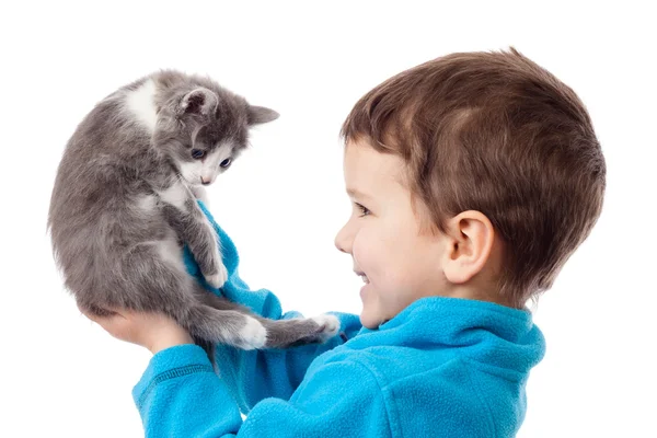 Little boy holding in hands adorable kitten — Stock Photo, Image