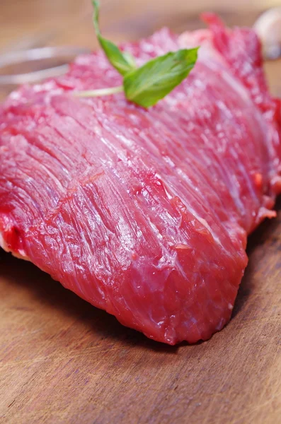 Raw meat steak with mint — Stock Photo, Image