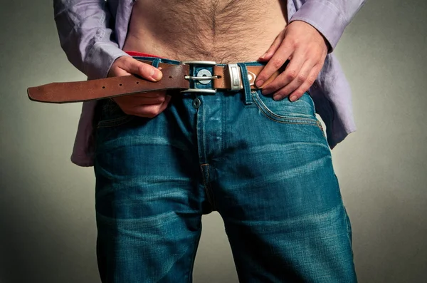 Man putting the jeans on — Stock Photo, Image