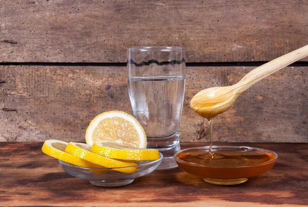 Water with lemon and honey — Stock Photo, Image