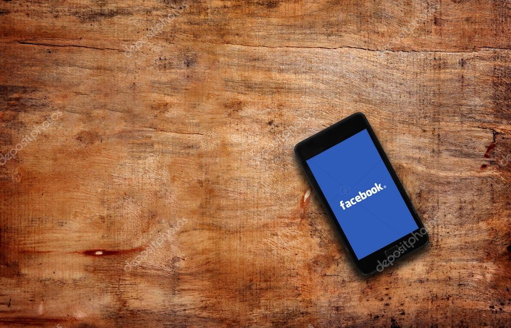 Melbourne,Australia-May 7,2015: Facebook page on the smartphone on table. Facebook is very well know social networking service founded in 2004 by Mark Zuckerberg