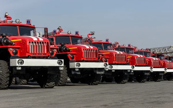 Several fire Trucks lined up at the field. — Stock Photo, Image
