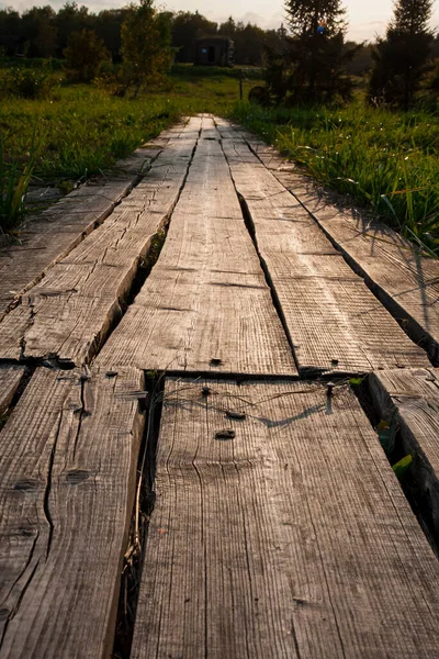 road to a field of wooden planks