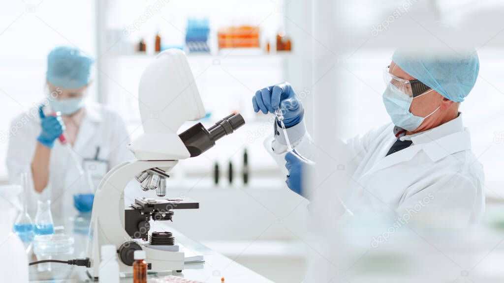 close up. scientist microbiologist working in the laboratory.