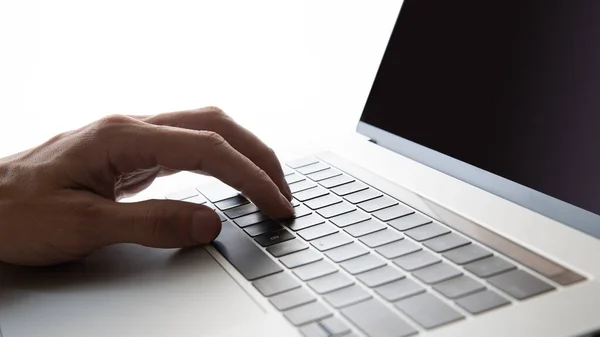 Close up. man typing on a laptop keyboard. — Stock Photo, Image