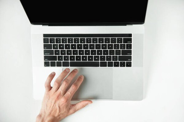 top view. casual man using the touchpad .