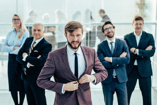 confident businessman standing in front of a professional busin