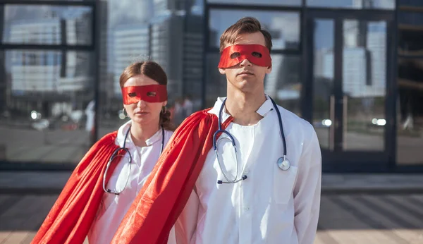 Close up. doctors are superheroes standing on a city street . — Stock Photo, Image