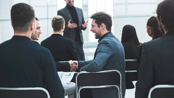 employees discussing financial issues at a workshop.