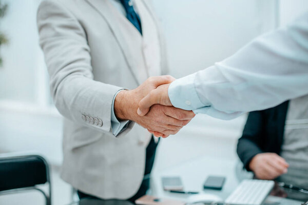 close up. businesswoman congratulating employees on success