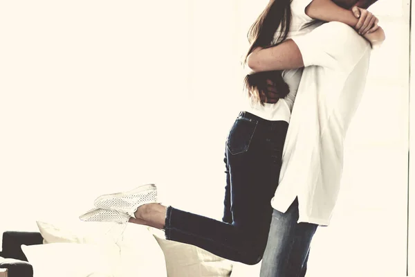 Young couple celebrating in their new apartment. — Stock Photo, Image