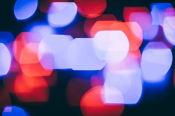 Festive background.blurred colored lights on a black background — Stock Photo, Image