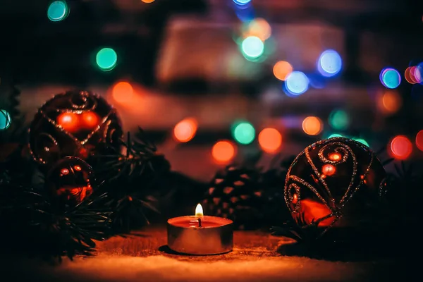 Candle and Christmas tree decorations.Christmas festive backgro — Stock Photo, Image