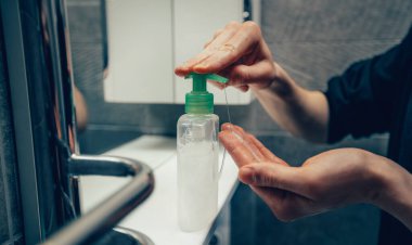 close up. man using bactericidal soap for washing hands.