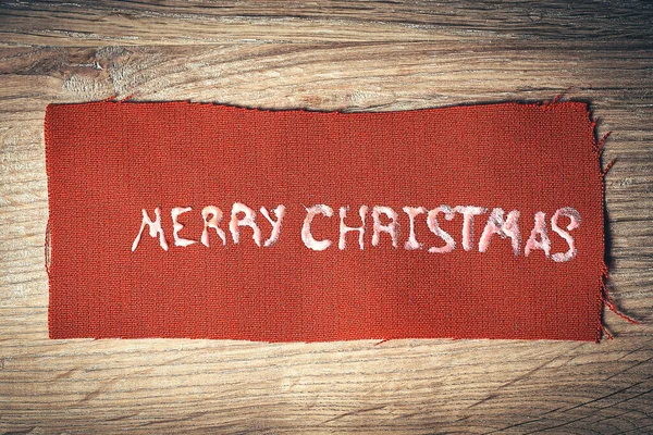 Fundo de Natal. a inscrição Feliz Natal em madeira — Fotografia de Stock