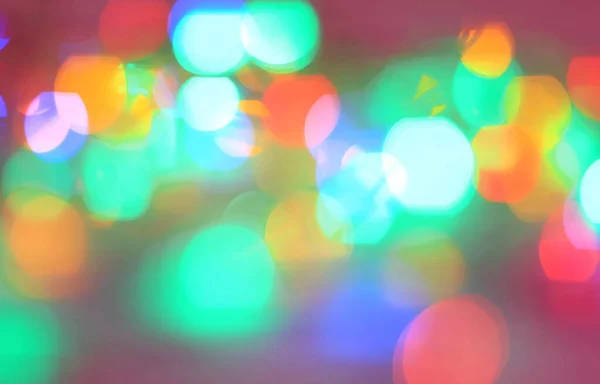 Festive background of blurred colorful bright lights. — Stock Photo, Image