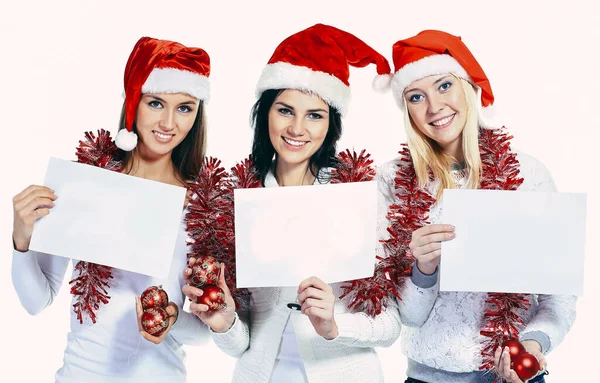 Grupo de estudantes do sexo feminino em trajes de Papai Noel segurando folhas em branco — Fotografia de Stock