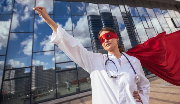 female doctor in a superhero Cape is ready to help .