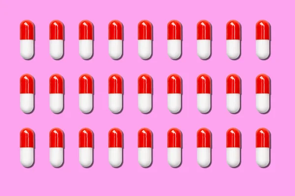 rows of red and white medical capsules on a red background.