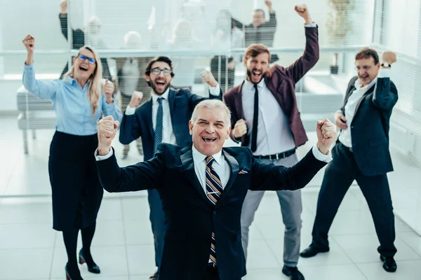 Group of happy business people exulting in the office — Stock Photo, Image
