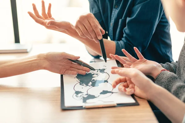 Close up. group of employees developing new logistics schemes. — Stock Photo, Image