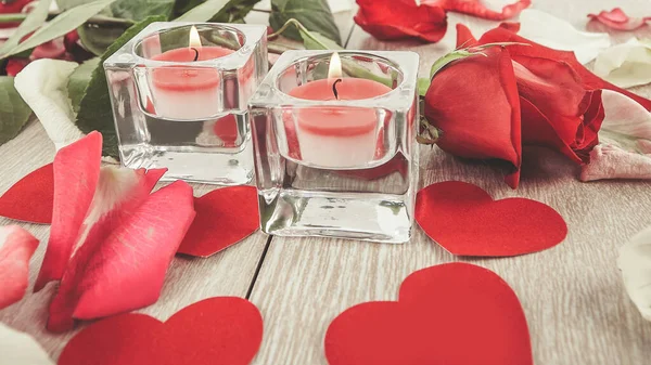 Two candles on a festive wooden background — Stock Photo, Image