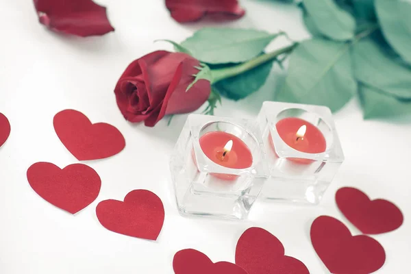romantic concept .burning candle and red rose . photo with copy