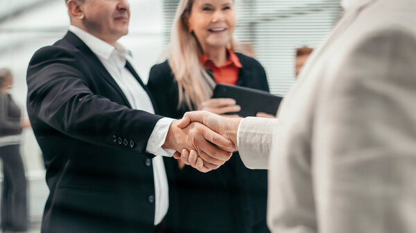 through the blinds. an entrepreneur meets his business partner