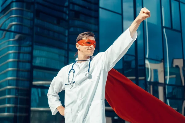 young doctor in a superhero Cape is ready for work.