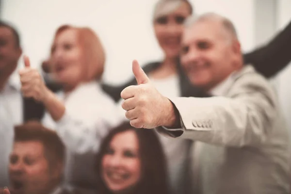 Close up. background image of business people with thumbs up. — Stock Photo, Image