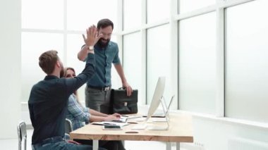 business colleagues greeting each other in the workplace.