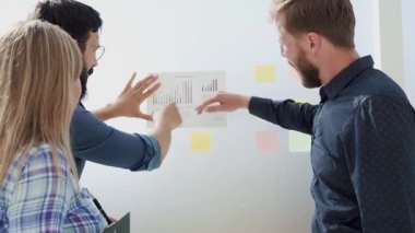 Manager and business team discussing the results of good work.