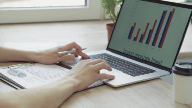 close up. business man using a laptop to check financial data.