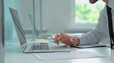 businessman starts checking financial statistics. close up.