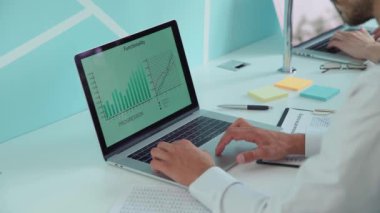 business man studies the table of financial growth.