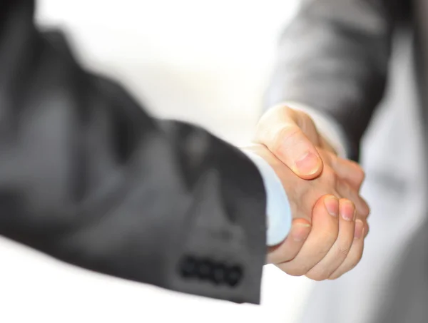 Closeup of a business hand shake between two colleagues — Stock Photo, Image