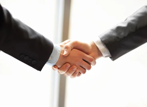 Closeup of a business hand shake between two colleagues — Stock Photo, Image