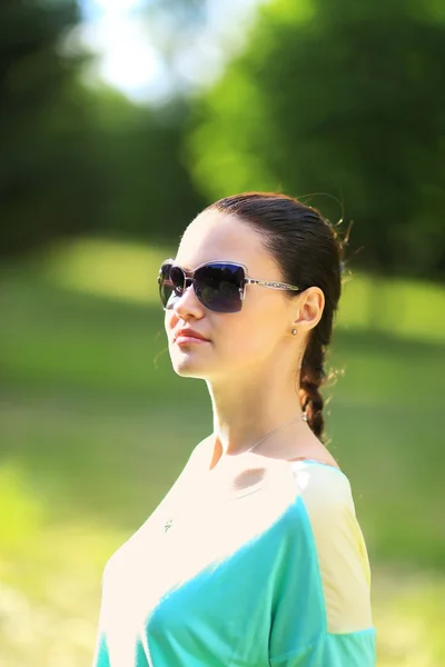 Portrait of the young beautiful smiling woman outdoors Royalty Free Stock Photos