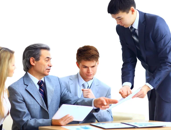 Business team interviewing young applicant in bright office — Stock Photo, Image
