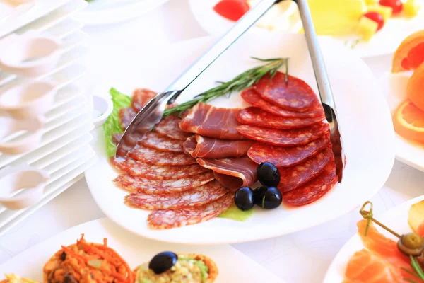 Catering table set service with silverware and glass stemware at restaurant before party — Stock Photo, Image