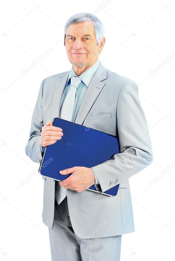 Nice businessman at the age, keeps the laptop. Isolated on a white background.