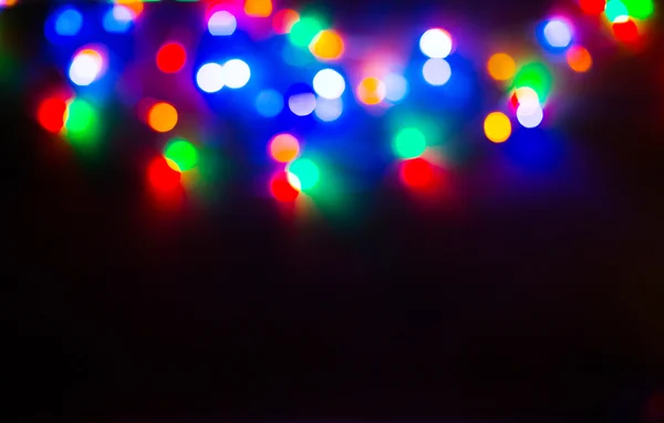 Rood en oranje vakantie bokeh. Abstract Kerst achtergrond — Stockfoto