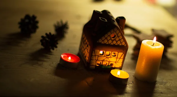 Fairy Christmas house cake with candle light inside and nice background lights — Stock Photo, Image