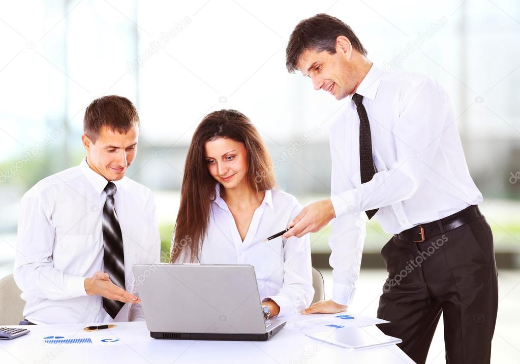 Business, technology and office concept - smiling female boss talking to business team