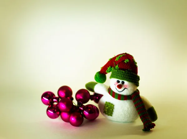 Cute snowman with Christmas balls on white background — Stock Photo, Image