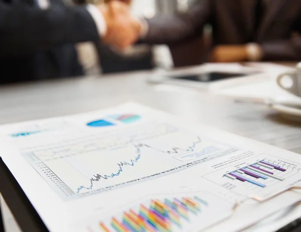 Close-up of female and male hands pointing at business document while discussing it — Stock Photo, Image