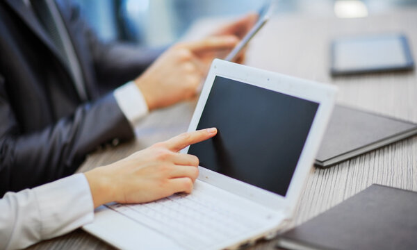 Hands of people working with tablet computer. Technology.