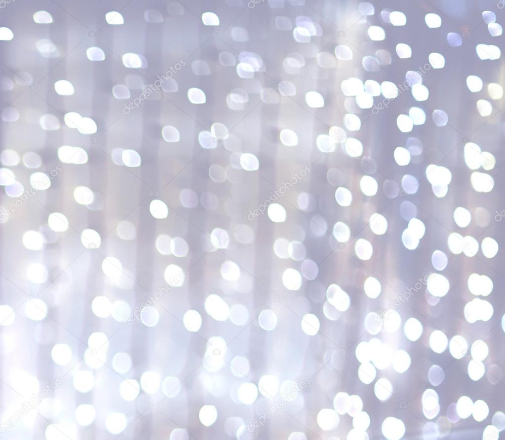 Silver and white bokeh lights defocused. abstract background